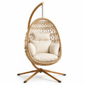Fauteuil suspendu œuf en rotin et acier avec coussins beige